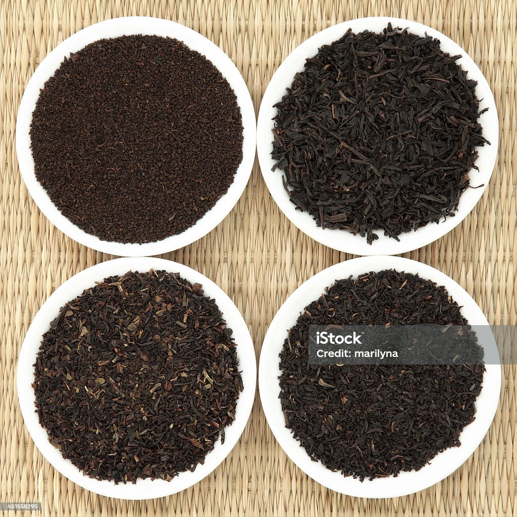 Tea Leaf Sampler Tea leaf selection of assam, darjeeling, earl grey and breakfast, left to right clockwise. Assam Stock Photo