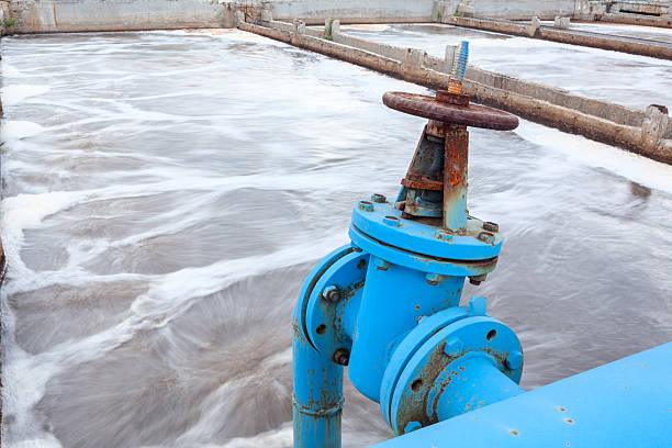 istock Industrial tap with blue pipeline for oxygen blowing into sewage 451558591