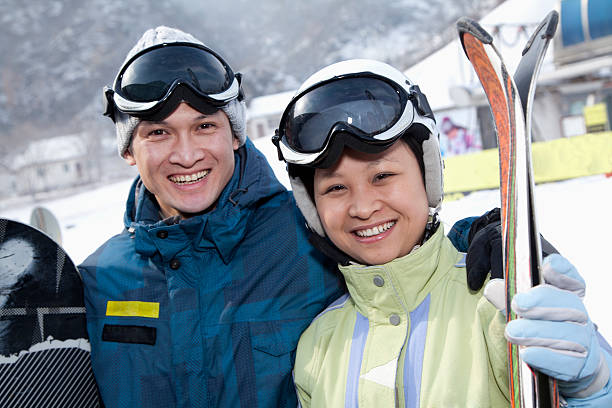 istock Smiling Couple in Ski Resort 451559227