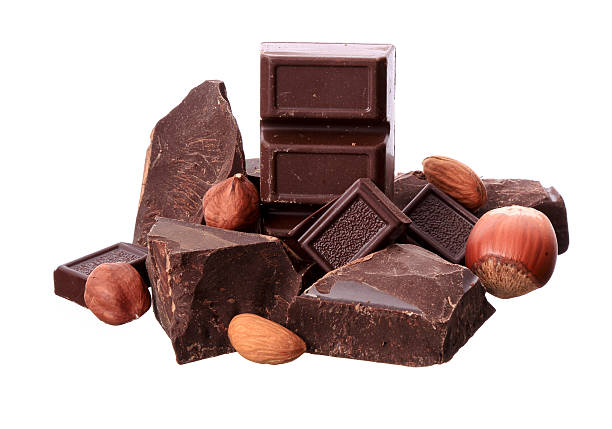 istock Pieces of chocolate and nuts  isolated on white background 451562011