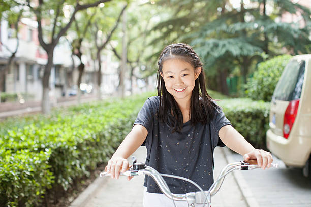 Young Girl Riding Her Bicycle