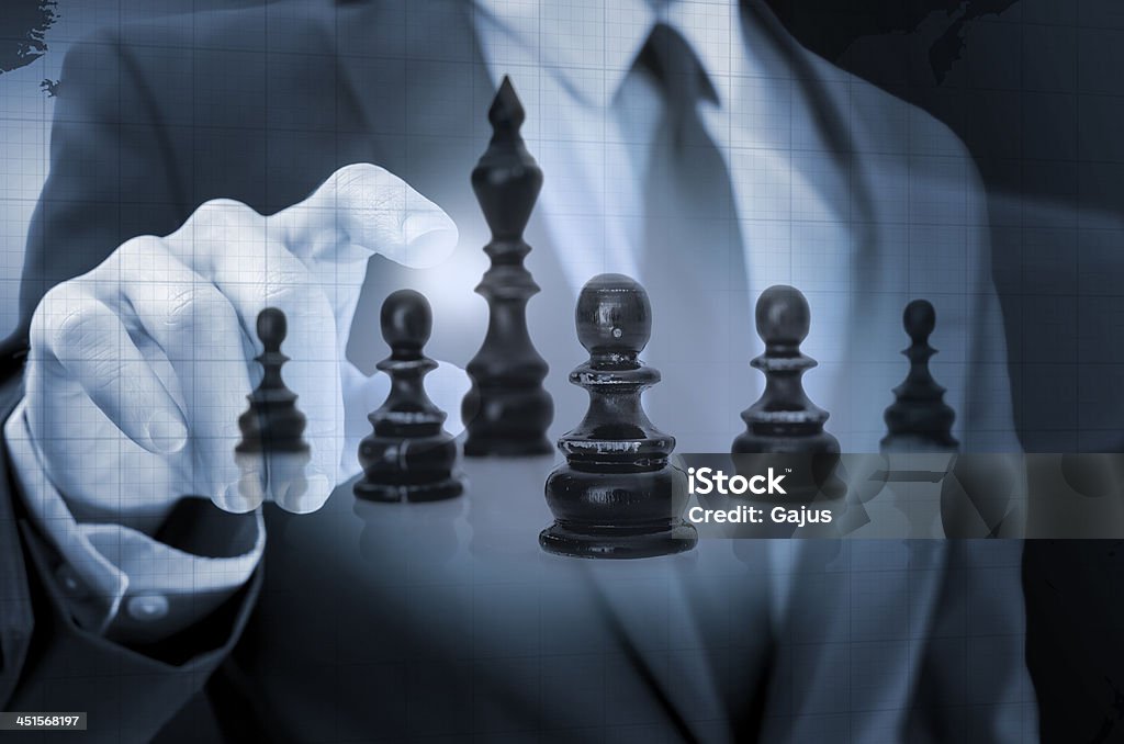 Business strategy concept Businessman navigating chess figures in virtual space. Concept of business strategy. Adult Stock Photo