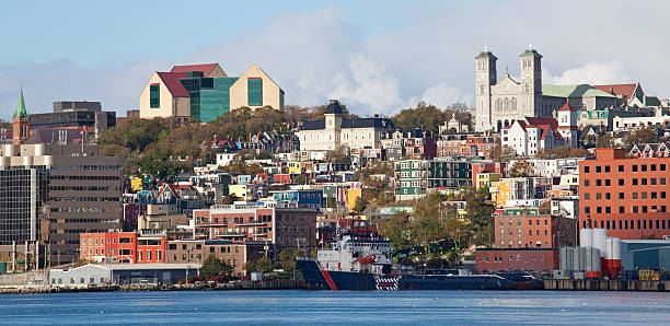 Downtown Cityscape of St. John's Newfoundland Downtown area of St. John's, Newfoundland. Cityscape of classic harbour view of the capital city of "The Rock," which is the island province in the Maritimes. St. John's has a rich history filled with Canadian themes of war, architecture, music, lore, and marine adventure. Nobody is in the image, taken in fall with Canon Mark 5D Mark II.  st. johns newfoundland photos stock pictures, royalty-free photos & images