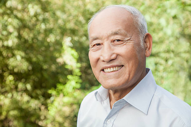 Portrait of an elderly man with a happy expression and smile stock photo