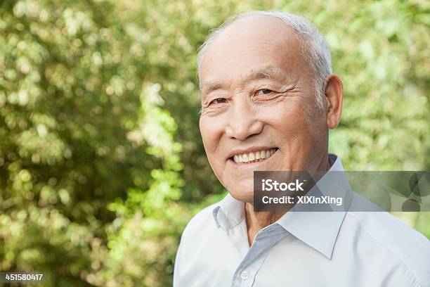 Portrait Of An Elderly Man With A Happy Expression And Smile Stock Photo - Download Image Now