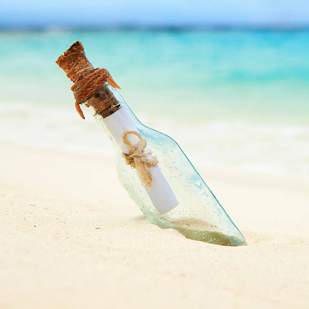 istock Letter in a bottle on the beach 451588885