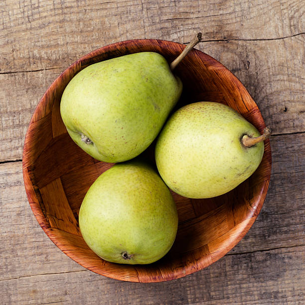 istock Group of pears on wood 451588985