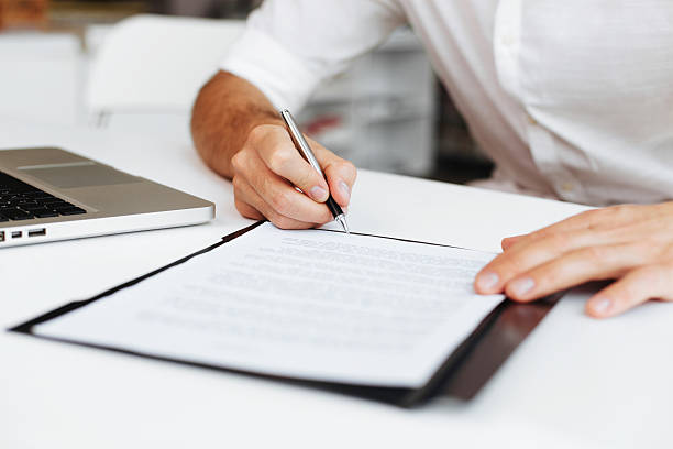 istock Close up of entrepreneur signing contract 451590717