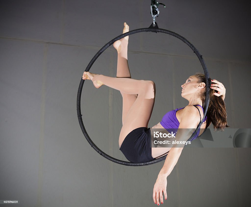 Gymnast Beautiful woman gymnast performing aerial exercises Acrobatic Activity Stock Photo