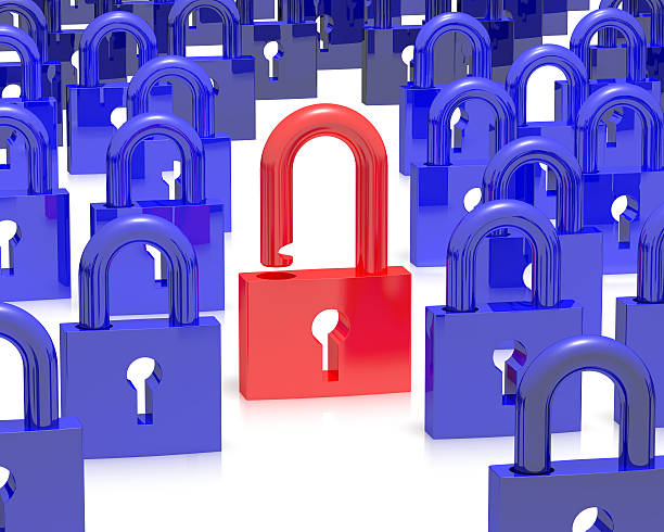 istock Group of blue padlocks with one red open one in middle 451596649