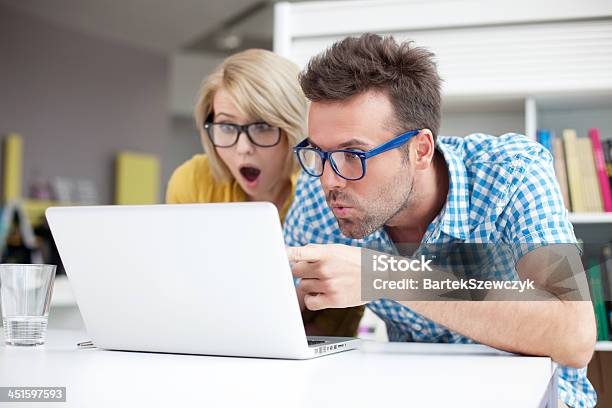 Two Surprised Students Learning In Library Stock Photo - Download Image Now - Humor, Eyeglasses, Computer