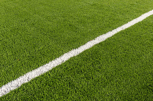 istock Football grass with white line 451600855