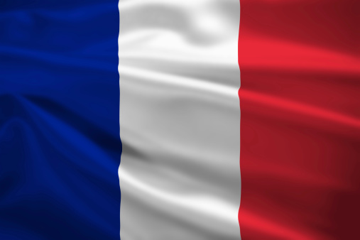 France flag blowing in the wind. Background texture.