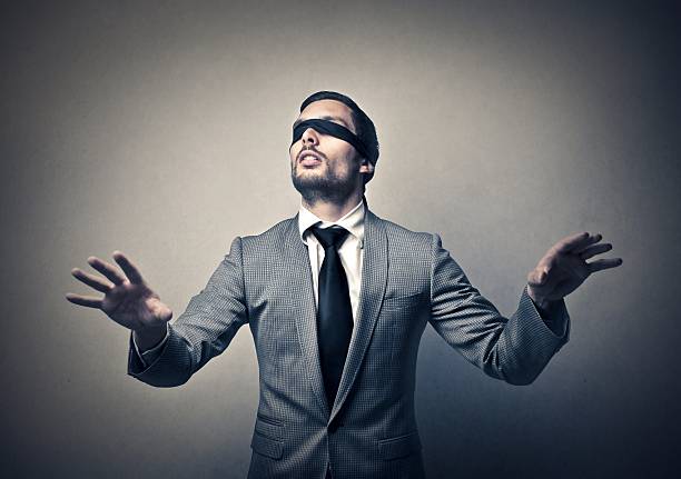 слепой человек - blindfold стоковые фото и изображения