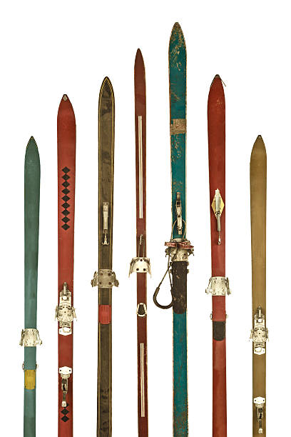 istock Vintage colorful used skis isolated on white 451611665