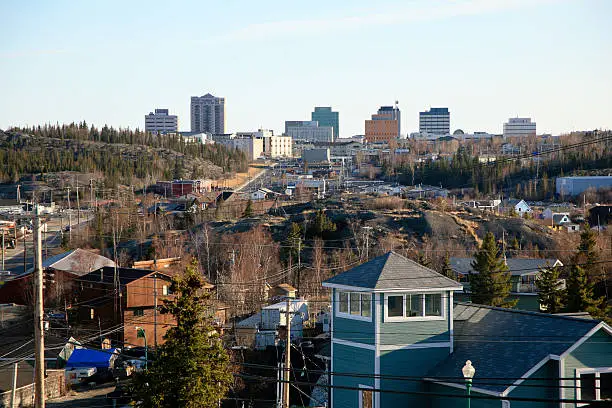 Skyline of Yellowknife with residental houses in the foreground. 