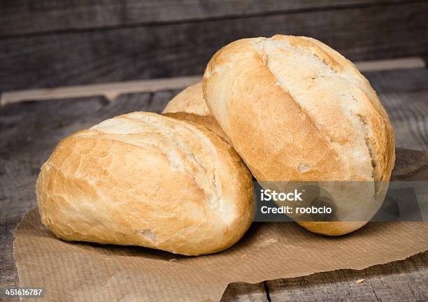 Wheat Bread Roll On A Cutting Board Stock Photo - Download Image Now - Autumn, Baked, Baking