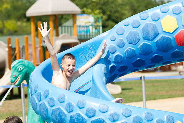 istock child  having fun in aqua park 451617977