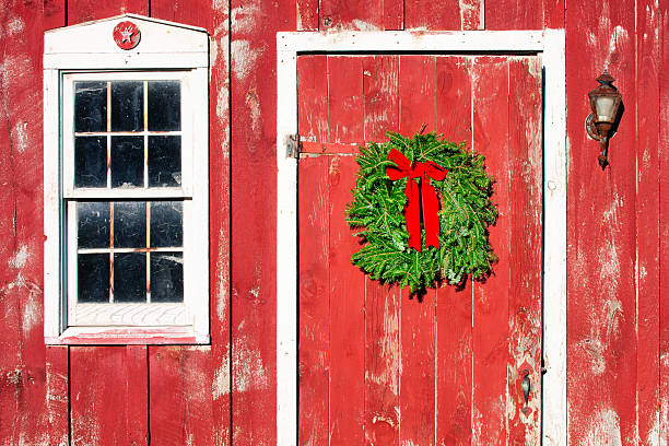 istock Christmas Wreath on Red Barn Door, horizontal format 451618201