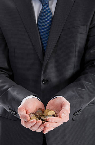 istock Businessman's hands holding coins 451622069