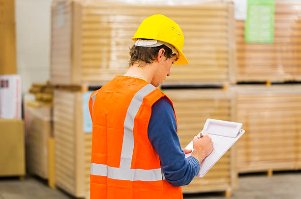 istock Warehouse worker is checking supplies of insulation material 451623533