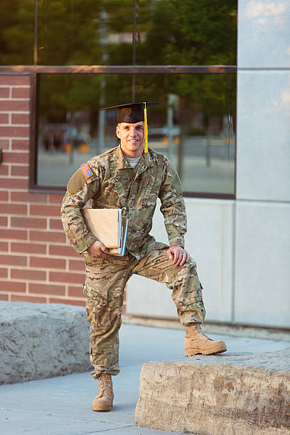 istock American Soldier with graduation hat 451627587