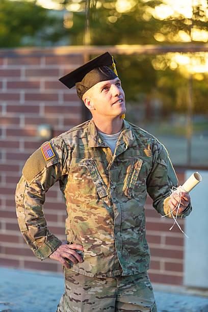 istock American Soldier with graduation hat 451630289