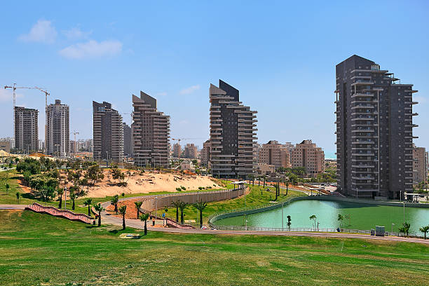 View of city park and tall modern buildings stock photo