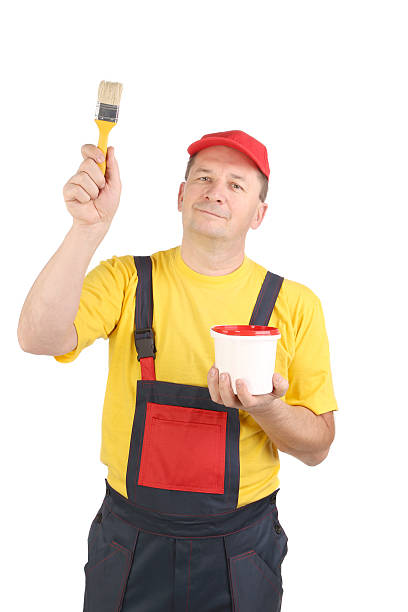 istock Worker holding bucket and brush 451631393