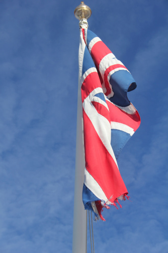 Union Flag slight movement in wind against bright blue sky