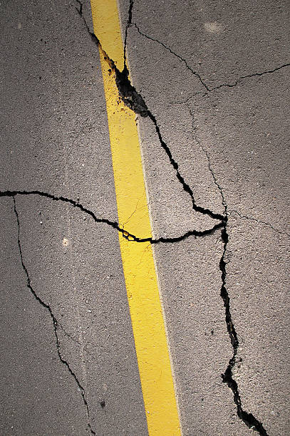 istock cracked asphalt after earthquake 451631553