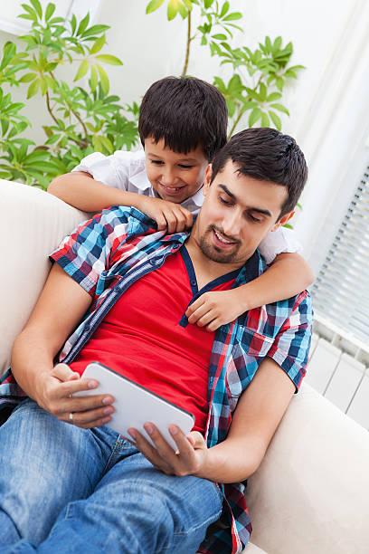 istock Father and son at home 451633409