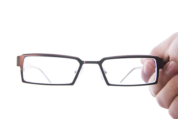 istock hand holding eye glasses 451636535