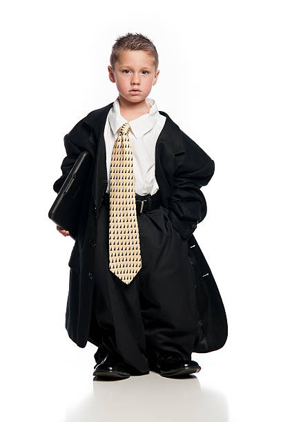 istock Little Boy Wearing Oversized Clothing and Tie Holding Clipboard 451637107