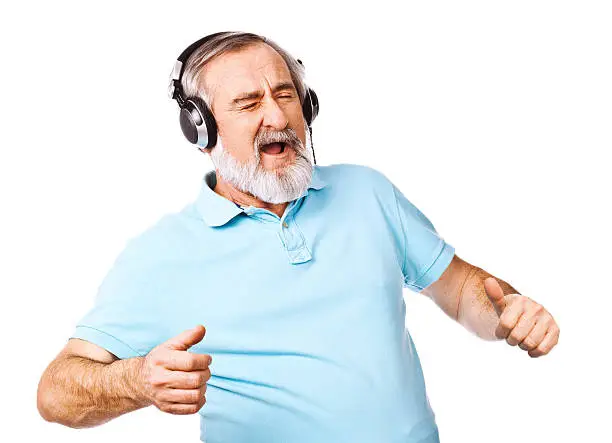 Excited old man listening to music