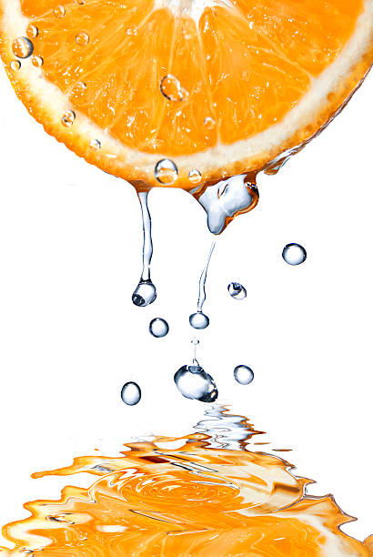 istock fresh water drops and orange isolated on white 451638691