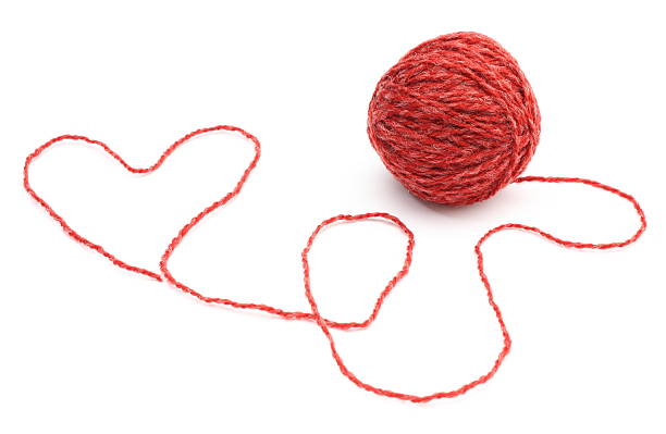 istock Heart shape and wool ball on white background 451647159