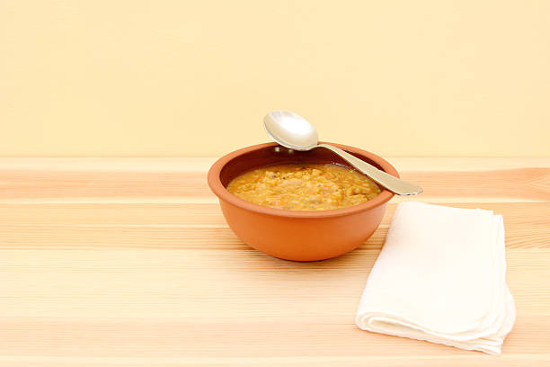 Vegetable soup with a spoon resting on the bowl