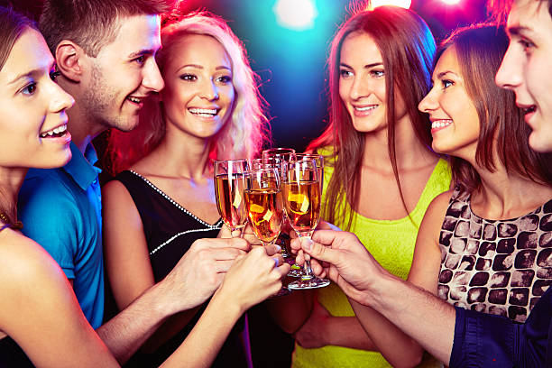 istock Young friends touching the glasses with each other 451663159