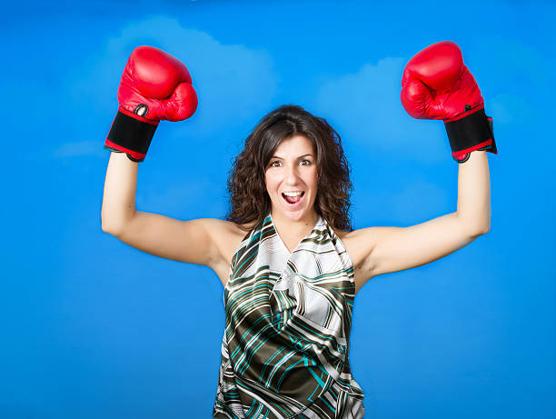 istock woman arms up for a boxing success 451672317