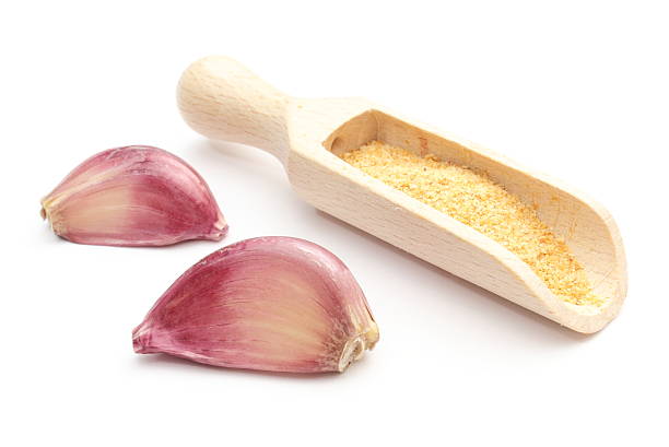 istock Garlic - fresh and loose on white background 451679403