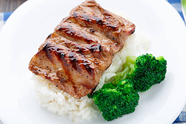 istock Grilled ribs with rice and broccoli 451682333