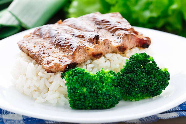 istock Grilled ribs with rice and broccoli 451685573