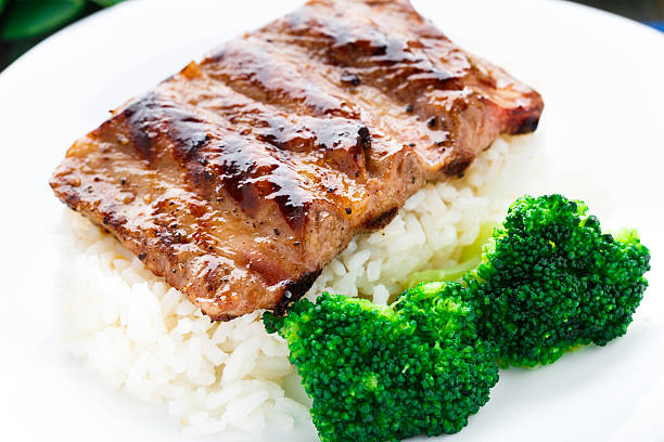 istock Grilled ribs with rice and broccoli 451685589