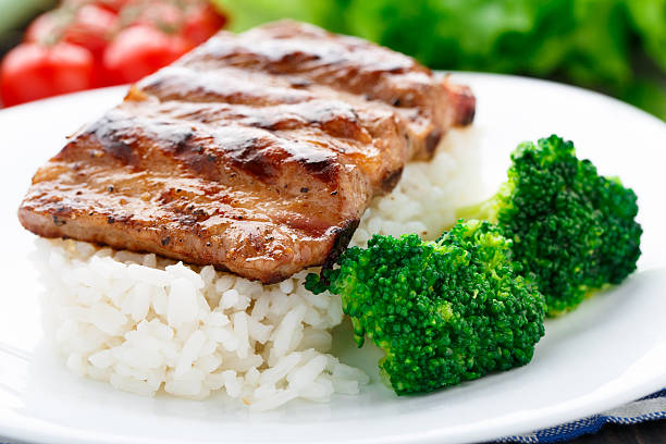 istock Grilled ribs with rice and broccoli 451685785