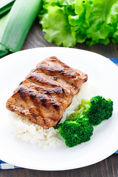 istock Grilled ribs with rice and broccoli 451685853