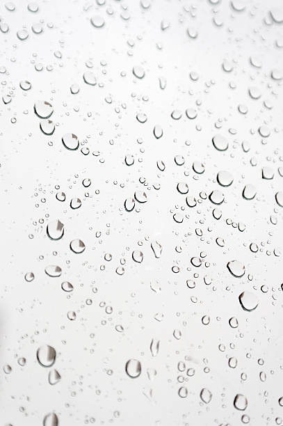 istock Drops of rain on the inclined window 451689913