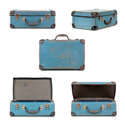 Small blue vintage suitcase in different views, isolated on white.  My old childhood school case.