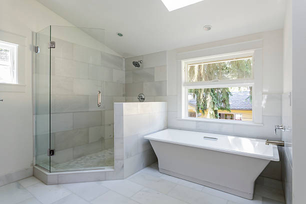 Modern bathroom with shower and bathtub stock photo