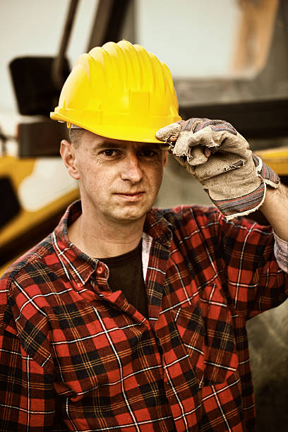 istock excavator operator in front of his vehicle 451783281